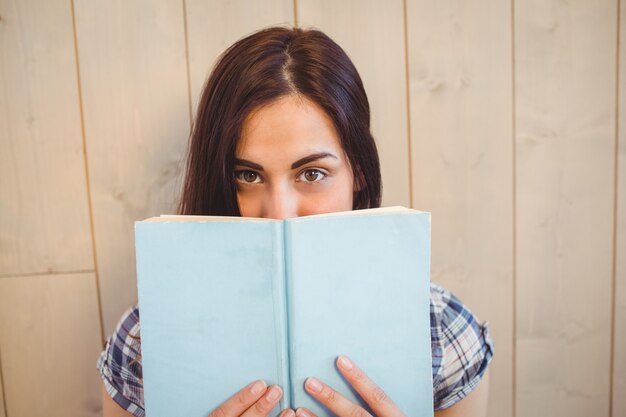 Pretty hipster reading blue book