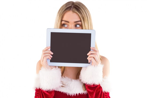 Pretty santa girl holding tablet