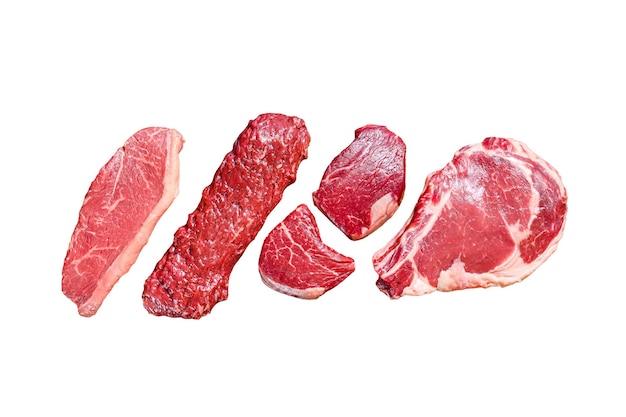 Primeira carne de bovino angus preta crua filete costela Mignon ou cowboy Striploin ou saia de nova York ou machete Isolado em fundo branco Vista superior