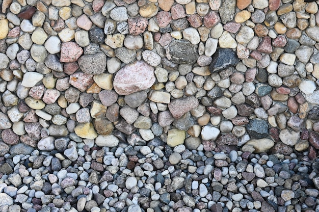 Primer plano de adoquines de piedra. Fondo de diferentes piedras