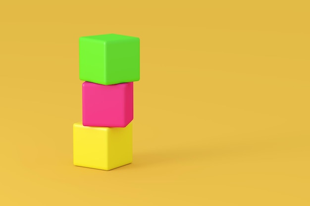 Primer plano de bloques de juguete apilados de varios colores contra un fondo amarillo