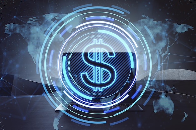 Primer plano de la computadora portátil en el escritorio con un icono de dólar redondo que brilla intensamente creativo y un holograma de mapa en un fondo borroso Moneda financiera y concepto de tecnologías de negocios globales Doble exposición