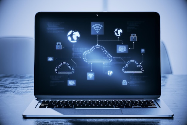 Primer plano de la computadora portátil en el lugar de trabajo con holograma creativo de computación en la nube digital sobre fondo borroso Concepto de servicio y datos en la nube Representación 3D