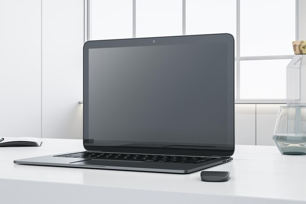 Primer plano del escritorio de la oficina con suministros de pantalla de computadora portátil vacíos y otros objetos Muro de hormigón borroso y ventana con vista a la ciudad en el fondo Representación 3D simulada