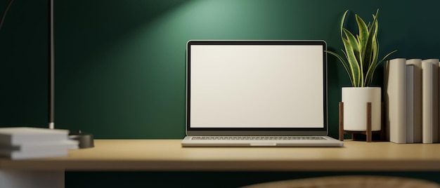 Primer plano, espacio de trabajo en el hogar moderno por la noche con maqueta de pantalla de computadora portátil y decoración en mesa de madera sobre pared verde. Representación 3d, ilustración 3d