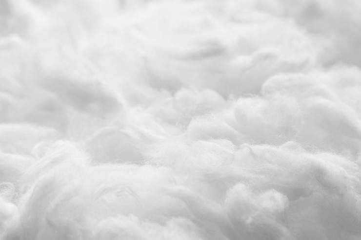 Primer plano de fondo de fibra suave blanca de textura de algodón