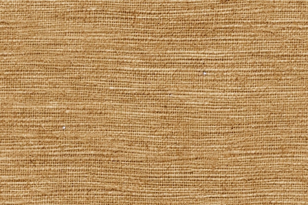 Un primer plano de un fondo generativo de tela marrón con textura