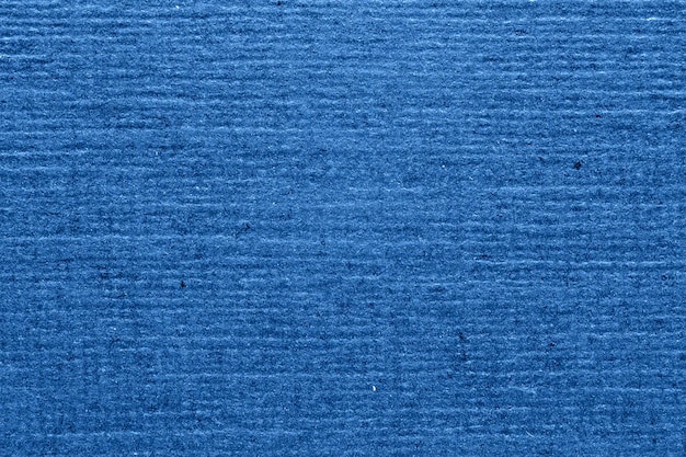 Primer plano de fondo de papel con textura azul Fondo granulado rayado para el diseño