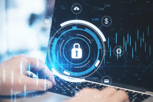 Primer plano de la mano del hombre de negocios usando el teclado de la computadora portátil con holograma de candado azul brillante con gráfico de forex y mapa sobre fondo borroso Concepto seguro y de seguridad en línea Doble exposición