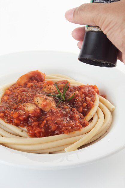 Foto primer plano de la mano en el plato