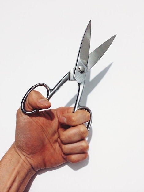 Foto primer plano de la mano sobre un fondo blanco