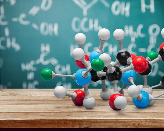 Foto primer plano del modelo de estructura molecular en el fondo