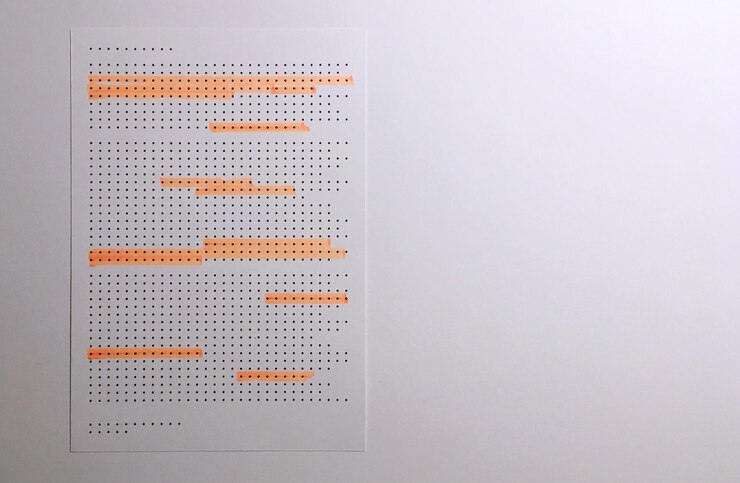 Foto primer plano de papel en la pared blanca