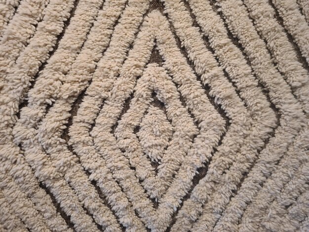 un primer plano de un patrón en una alfombra.
