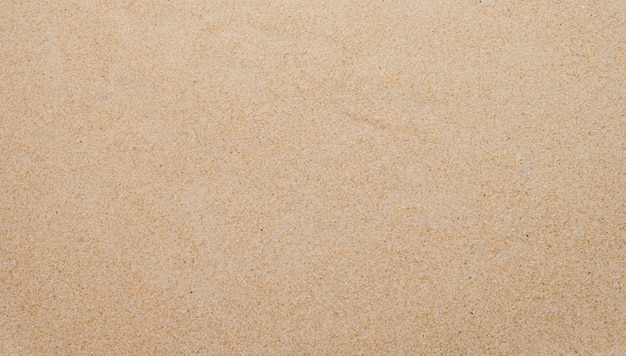 Primer plano de patrón de fondo de arena de una playa en el verano