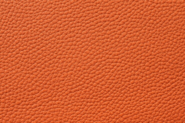 Primer plano de una perfecta textura de cuero naranja para el fondo