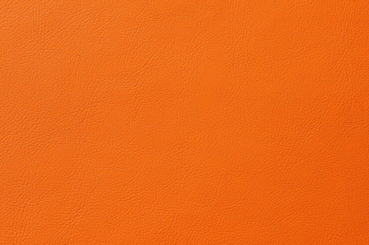 Primer plano de una perfecta textura de cuero naranja para el fondo
