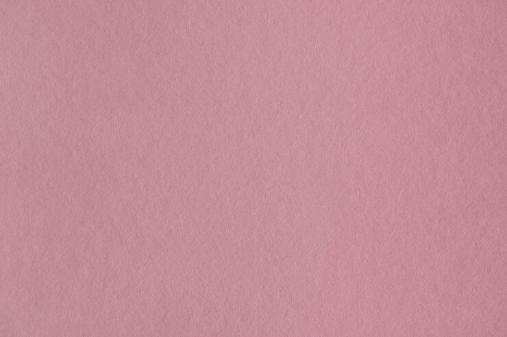 Primer plano de una perfecta textura de papel rosa para el fondo o las obras de arte