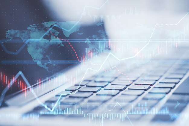 Primer plano del teclado de la computadora portátil con un gráfico de divisas brillante creativo sobre fondo borroso Estadísticas de economía de finanzas comerciales Doble exposición