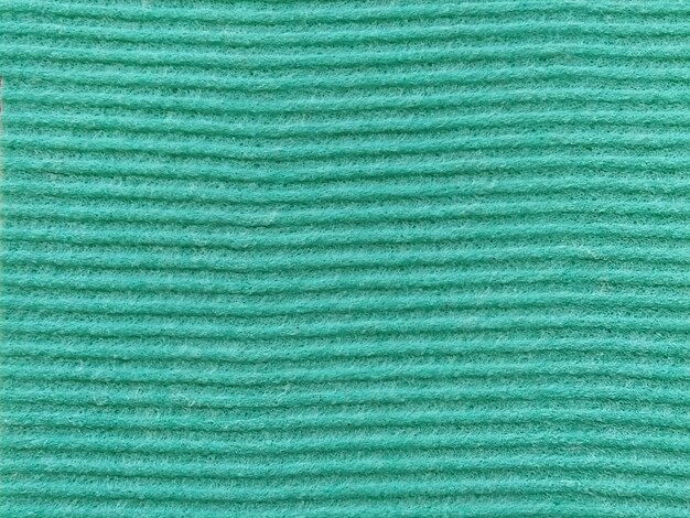 Primer plano de una tela a rayas con estampado en relieve Rayas horizontales en microfibra o esponja verde