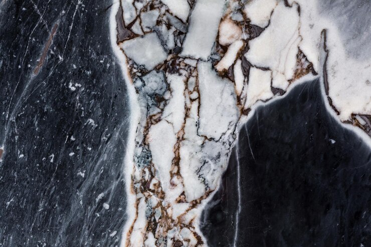 Foto primer plano de textura de mármol con tonos oscuros y claros perfecto para interiores de lujo