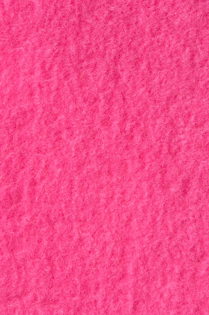 Foto primer plano de textura de tela rosa magenta como fondo