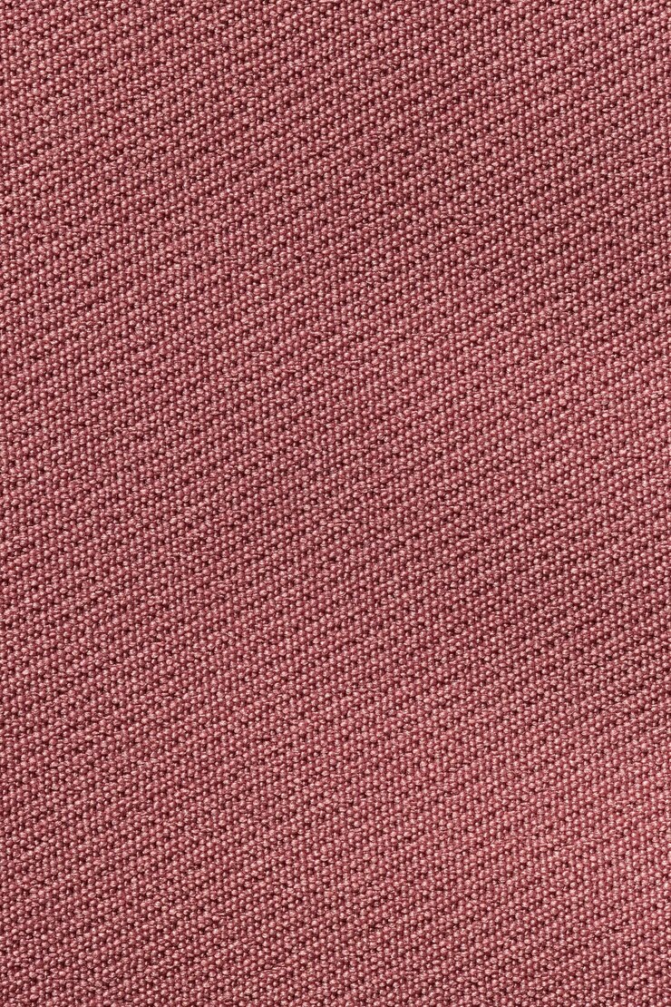 Foto principalmente textura de poliéster de tecido de cor vermelha escura desaturada e fundo têxtil