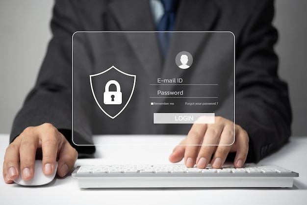 Protección de datos personales contra piratas informáticos Seguridad acceso a Internet de datos personales Seguridad de la información de identificación y cifrado Hombre escribiendo inicio de sesión y contraseña en la pantalla virtual