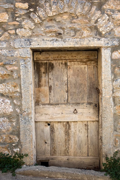 Puerta vieja, fondo de textura de madera y pared