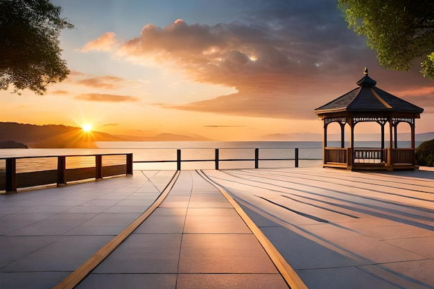 Una puesta de sol en una playa con un mirador y un mirador.