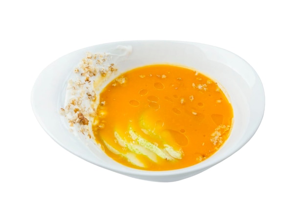 Purê de sopa de abóbora em um prato branco Apetitoso prato tradicional de outono Vista superior Isolado no fundo branco
