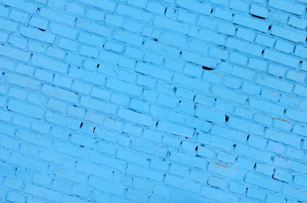 Quadratischer Backsteinblockwandhintergrund und -beschaffenheit. In blau lackiert