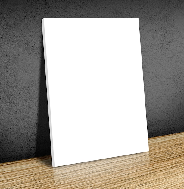 Quadro de cartaz branco em branco no chão de madeira e parede de concreto preto