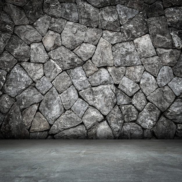 Foto quarto de parede de pedra interior e piso de concreto com espaço