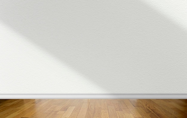 Quarto vazio com parede branca com sombras abstratas na superfície e piso em parquet de madeira