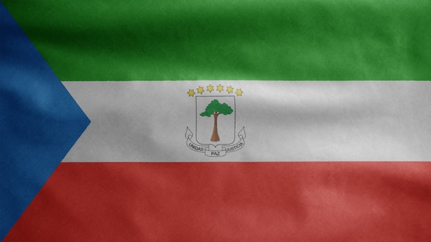 Äquatoguineische Flagge weht im Wind. Nahaufnahme von Äquatorialguinea Banner weht, weiche und glatte Seide. Stoff Textur Fähnrich Hintergrund. Verwenden Sie es für das Konzept für Nationalfeiertage und Länderfeiern