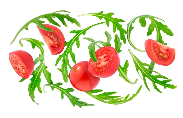 Queda de legumes frescos Tomate cereja e rúcula isolado no fundo branco