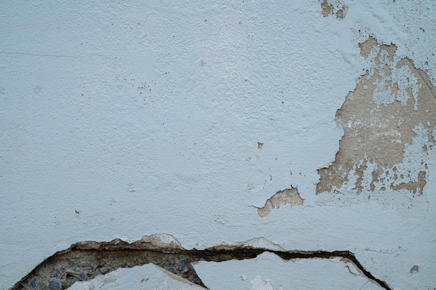 Rachadura a parede de cimento de argamassa de textura de piso de concreto
