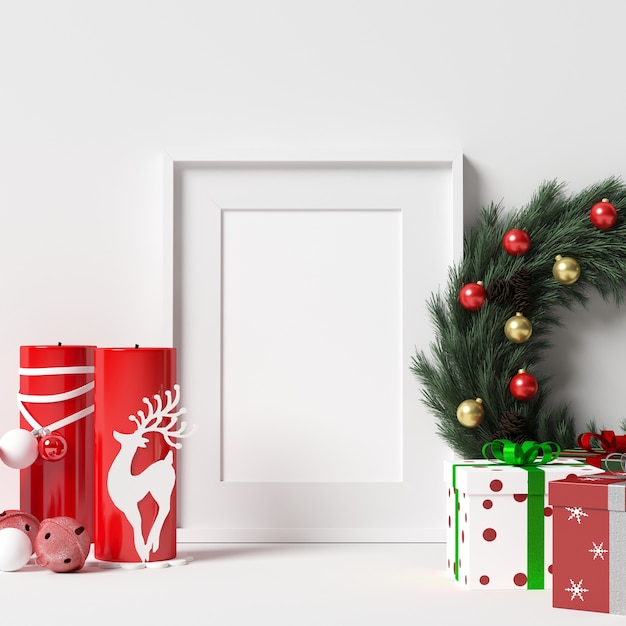 Foto rahmen-modell auf weißer wand mit weihnachtsdekoration