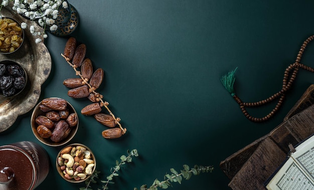 Ramadan concept with Quran prayer beads dates 