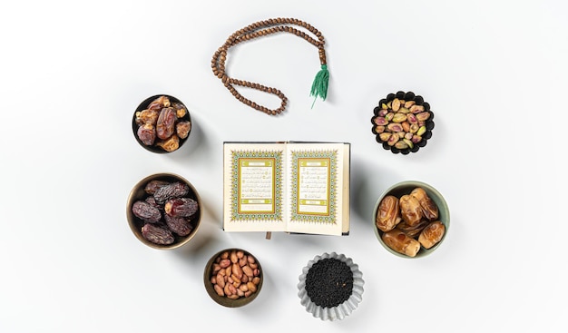 Ramadan concept with Quran prayer beads dates 