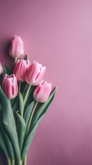 Un ramo de tulipanes rosas sobre un fondo rosa