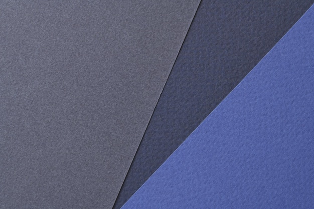 Raue Kraftpapierhintergrundpapierbeschaffenheit verschiedene Blautöne Mockup mit Kopienraum für textxA
