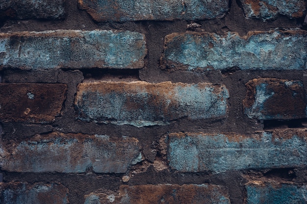 Raue Ziegelmauer im Denim-Stil. Weinlese rustikaler Texturhintergrund