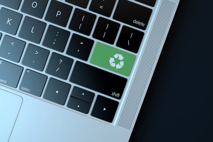 Foto reciclar el icono en el teclado de la computadora portátil. concepto de tecnología