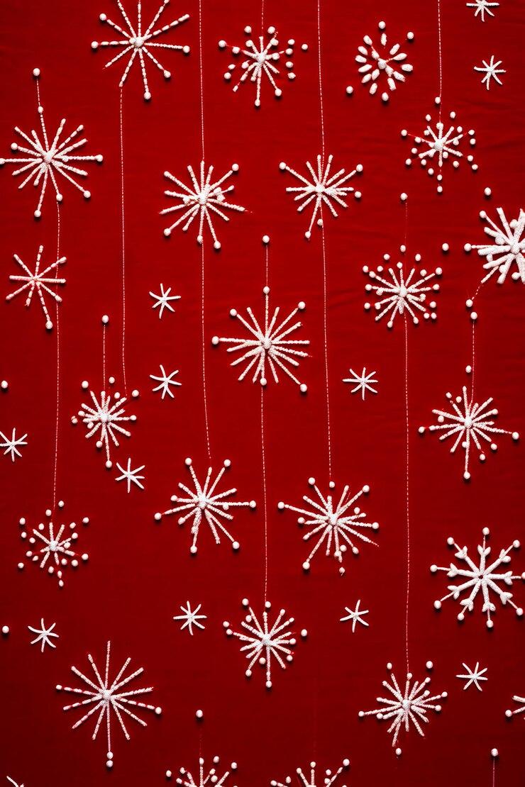 Foto red background with white snowflakes hanging from strings generative ai