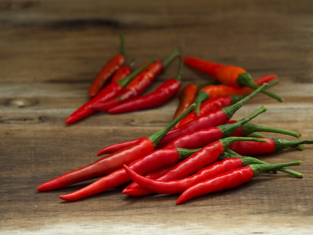 Red hot chili peppers on wooden table