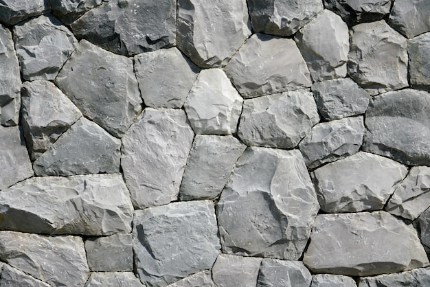 Foto redondo y pentágono fondo de piedra negra y papel tapiz