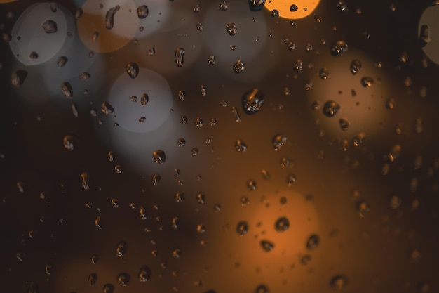 Regentropfen auf blauem Glashintergrund Straße Bokeh unscharf Zusammenfassung Hintergrund
