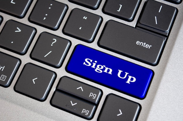 Registro de texto en el teclado azul Registro y concepto de registro en línea